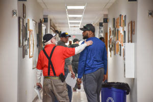 electricians in hallway